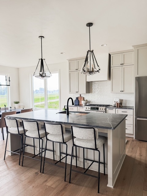 Designed with both style and functionality in mind, the gourmet kitchen showcases custom cabinetry, leathered granite countertops, a spacious 8-foot island, and premium appliances. #homedecor #interiordesign 

 #LTKHome