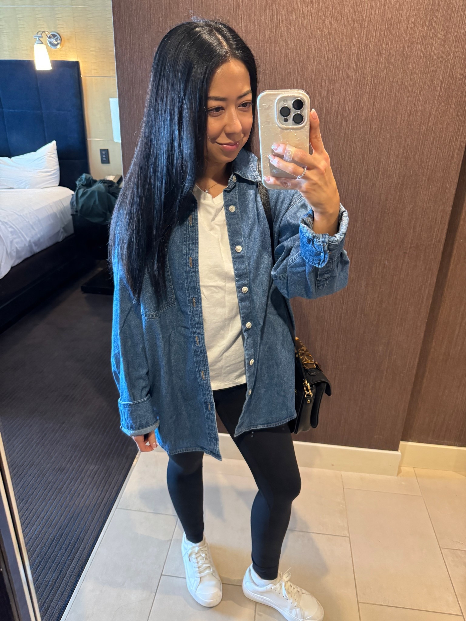 Easy go to outfit that I love especially for travel. 
Aritzia chambray denim shirt. Super oversized. I sized down 1 to XS.
Nuuds white tee. So good. Size small TTS.
Lululemon align leggings size 4. TTS. 
DR Scholl’s white sneakers with a slight platform. Size 5 TTS
Purse is LV Pochette Métis. 
Linked my jewelry as well. 

#LTKTravel #LTKPetite #LTKmomlife