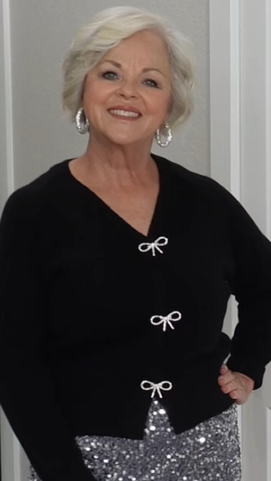 Would you believe this glam outfit is under $60? ✨ The shimmery skirt looks high-end, moves beautifully when you’re dancing, and the rhinestone-bow sweater brings all the luxe vibes. Boujie on a budget for women over 40/50 has never looked so good. 💃✨ 

#LTKMidsize #LTKOver40 #LTKHoliday