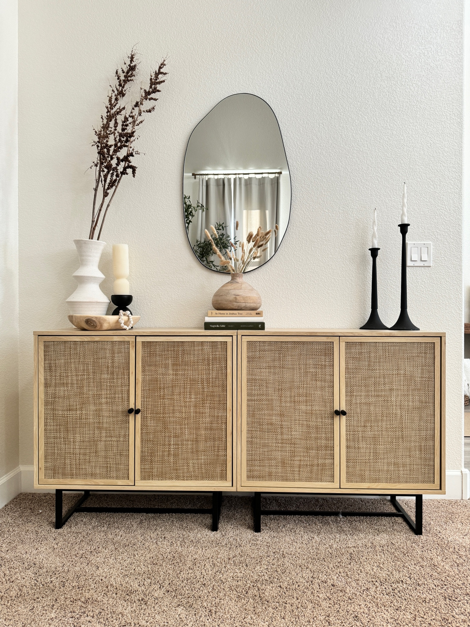 This gorgeous storage cabinet is in my front sitting room in my home and has given us so much extra storage! It is definitely inspired by a piece I saw from a more expensive brand, but this one is a bargain! The quality is amazing, and I love the organic modern vibes it adds. Plus, with the natural shaped mirror and decorative pieces, it’s more than just storage! It’s a statement! 

#LTKhome