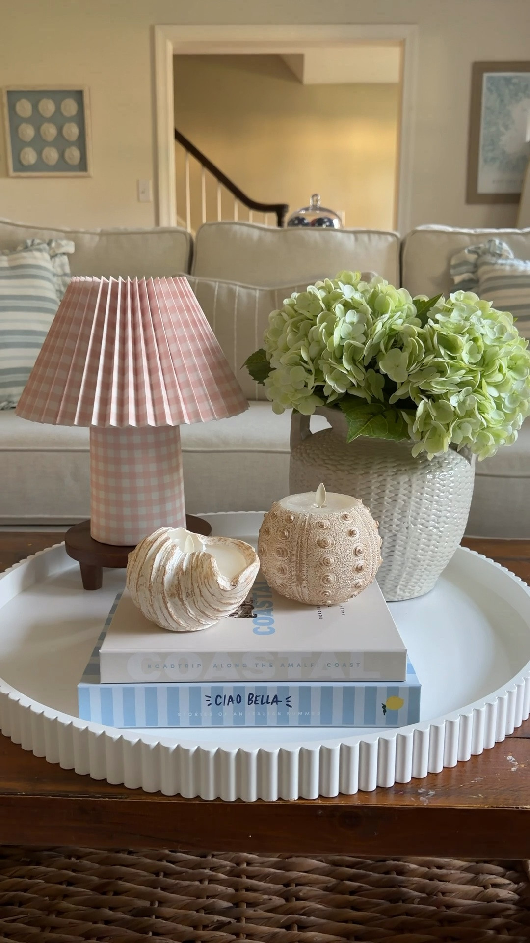 My jaw DROPPED when I saw this new gingham lamp! It’s just adorable and only $20! I decided I wanted to use it on my coffee table so I used my favorite trick to turn any lamp cordless—the lightbulb and remote set is less than $15 and works so well! The lightbulb clicks on and off the magnet base for charging.