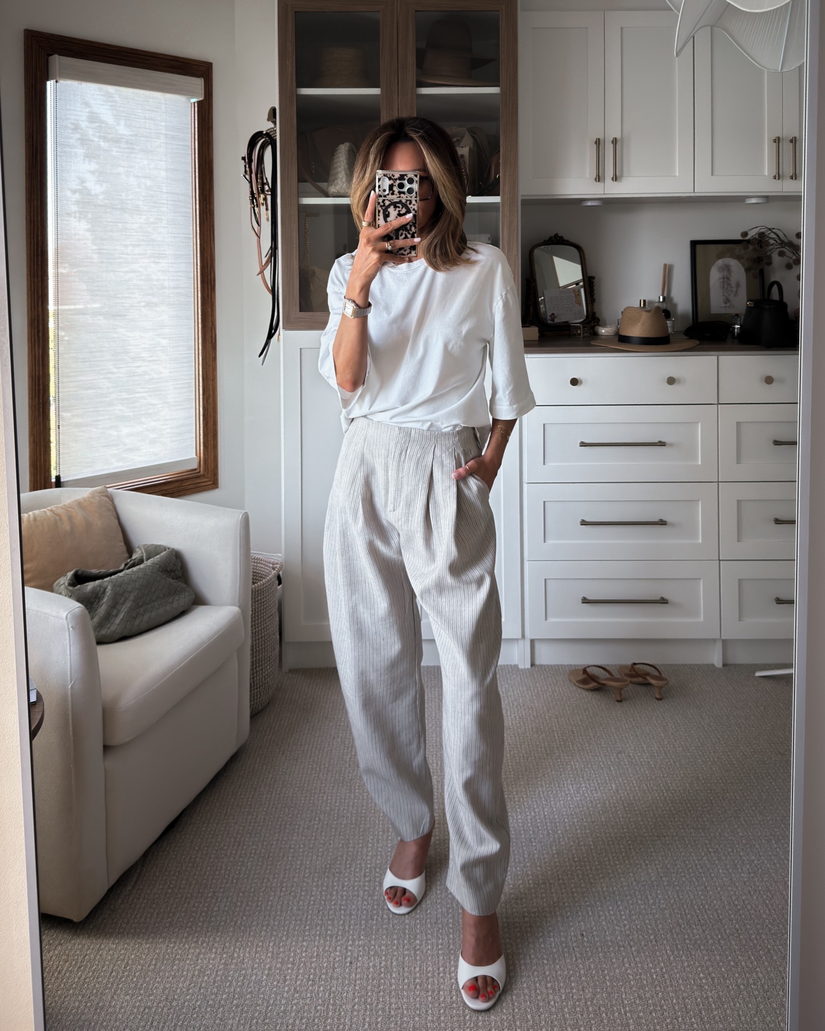 Zara linen striped trousers, love the pleats and slight barrel silhouette, adds a bit of menswear touch - oversized tee all size xs

#LTKOver40 #LTKSeasonal #LTKootd