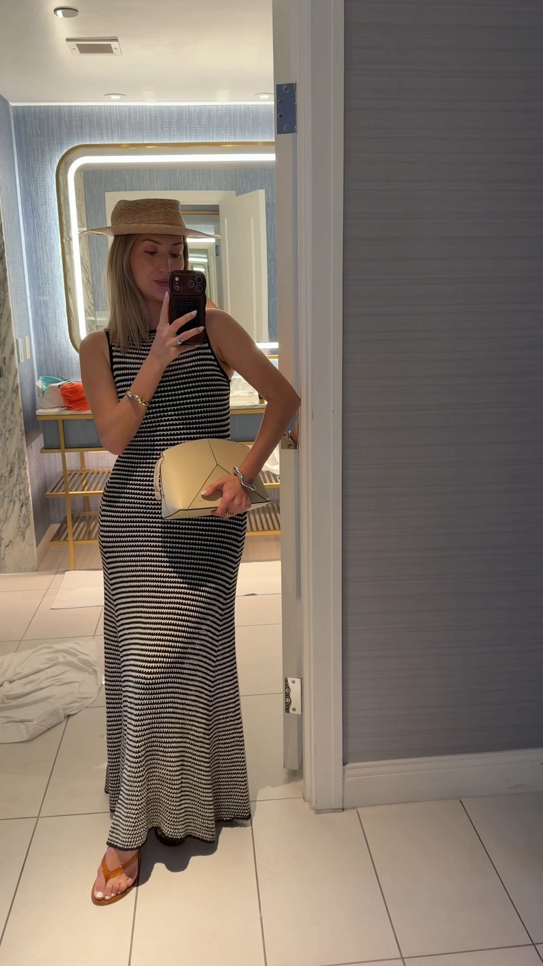 Straw boater hat 
Maxi dress 
Victoria Beckham clutch tote handbag 
Cuff bracelets 
Jelly sandals TTS 

Vacation outfit 
Summer outfit

#LTKdayinmylife #LTKTravel #LTKootd