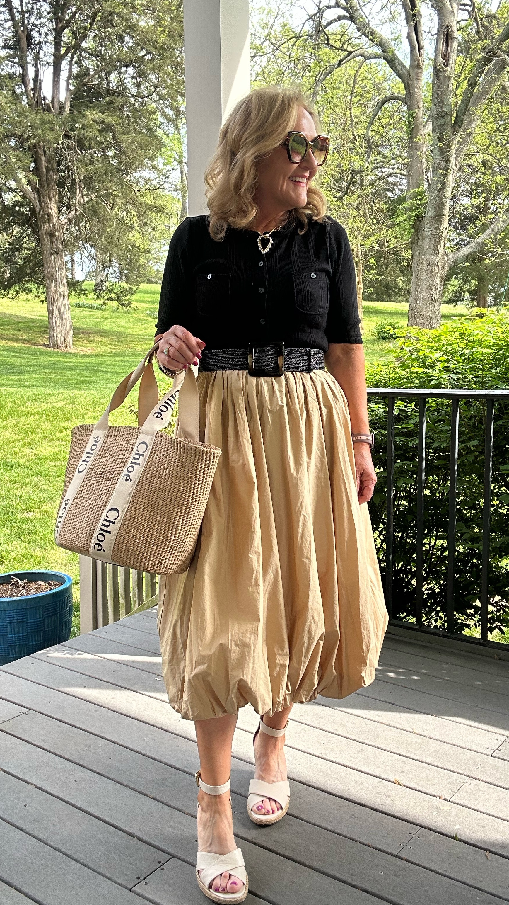 The trending bubble skirt done by loft is perfection. I am wearing a size medium petite. I paired it with a fitted black knit cardigan and rafia belt . All by LOFT! And all 50% off Easter weekend.

Chloe woody bag found at a discount! I ordered from this company! Very reputable. 
My wedges are vionic so very supportive and comfy. Found at the rack! 
Allie Bess 30% off code BLOG Easter weekend only 



#LTKOver40 #LTKSaleAlert #LTKWatchNow