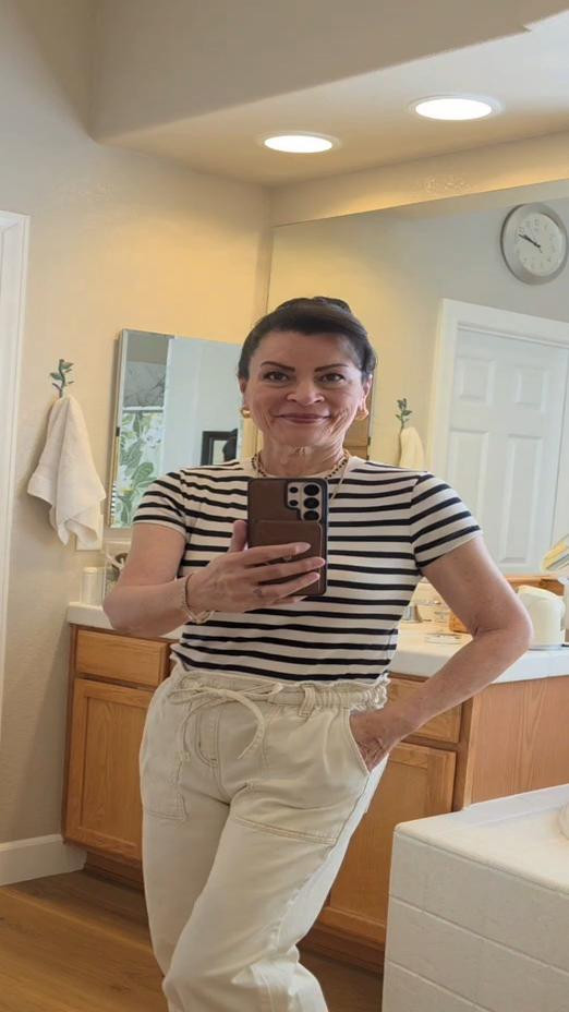 Hello! Here's today's outfit ✨️ I love the stripes as a bit of pop in this monochromatic look. The Puma sneakers are so chic and textured.You can totally look put together without wearing high heels. Layering your necklaces adds so much to any look!Tops in mediums and pants in a small. 

#LTKootd #LTKOver40 #LTKMothersDay