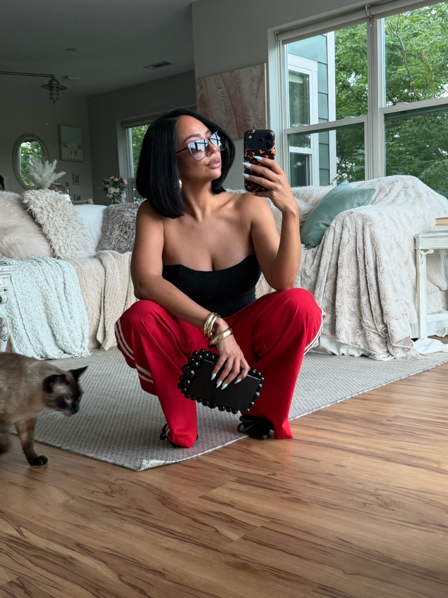 Photobombed 📸 Street style dinner / drinks outfit pairing track pants, a corset and heels ⚡️

#LTKootd #LTKOver40 #LTKPetite