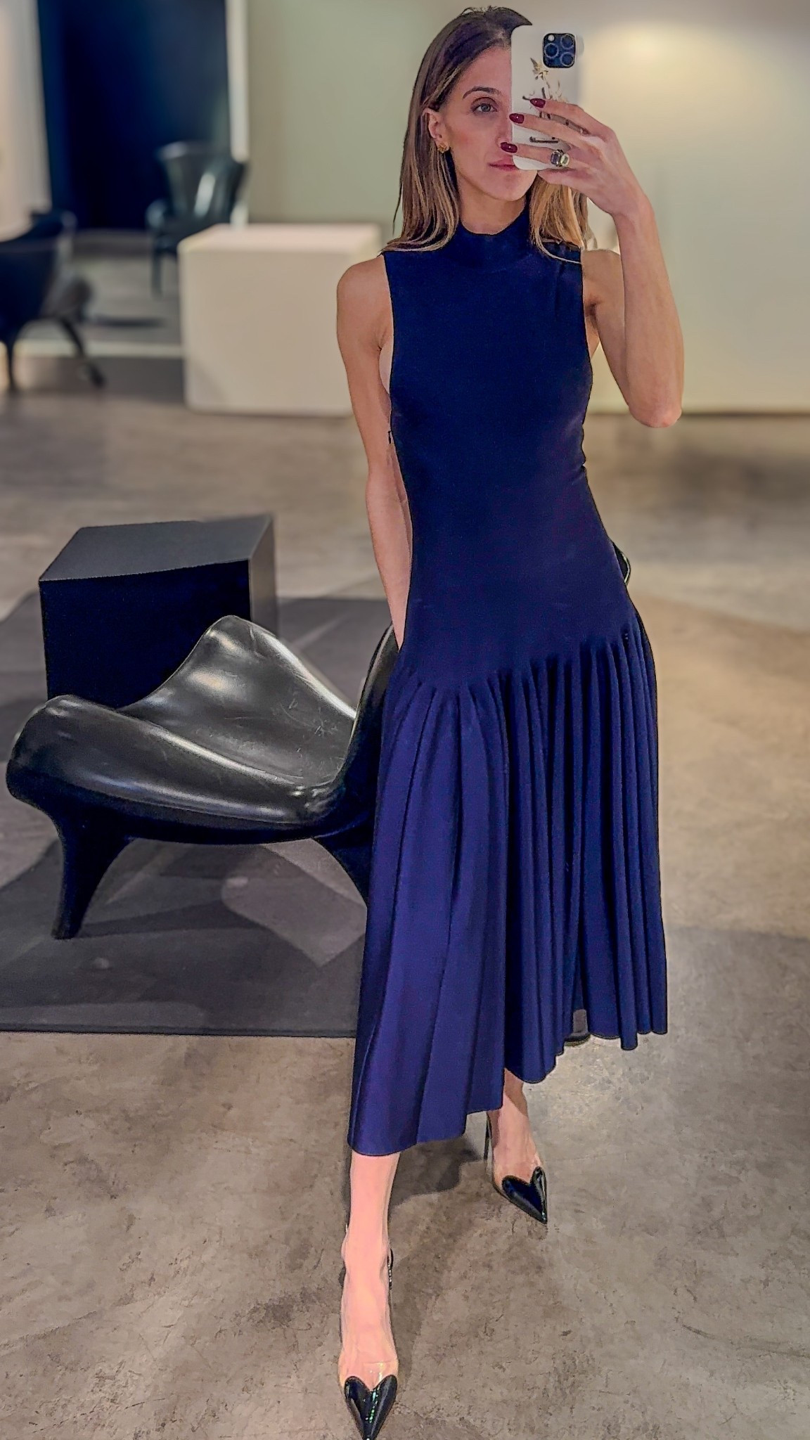 Head-to-toe Alaïa in deep navy: a mock-neck sleeveless dress with a fluid pleated midi skirt, finished with sharp pointed pumps. Minimal, sculpted, and perfect for gallery nights or chic dinners.

Alaïa full look, navy midi dress, mock neck, sleeveless dress, pleated skirt, pointed pumps, evening outfit, modern minimal, luxury style

#LTKdresses #LTKdatenight #LTKpartywear