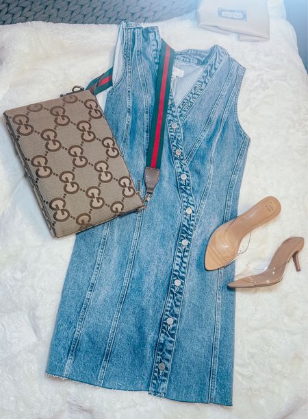 You guys…. This is the MOST perfect denim dress, IMO.
It has that cool ‘90’s vibe to it, but is so current. Sleeveless and vneck. The dress does run small, however the material has a good amount of stretch to it. So, I’d say to size up, but only by a bit.
I paired it here with this adorable canvas Gucci cross body and clear heels.
Date night dress, denim dress, summer outfit, summer dress, work outfit, cross body bag, heels, slides, mules, denim, jean dresss

#LTKSeasonal #LTKFestival #LTKStyleTip