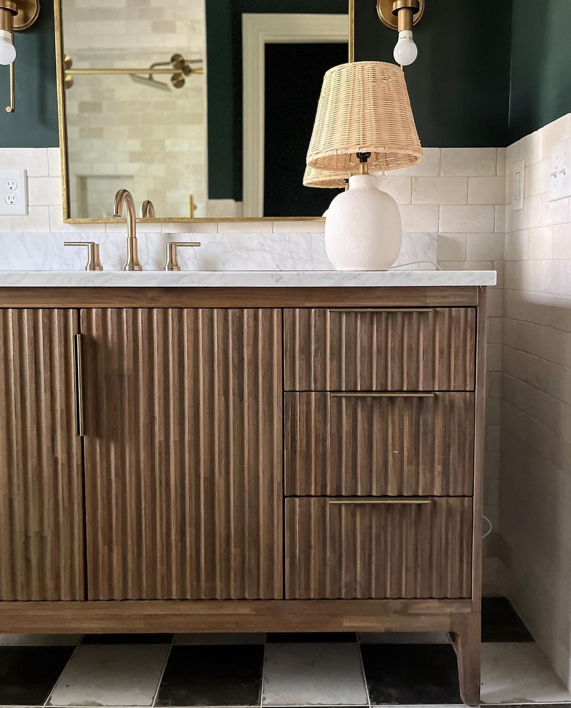 Classic with a confident twist 🖤 This bathroom pairs timeless black and white checkered floors with rich green walls for a look that feels both fresh and enduring. The contrast brings character, while polished fixtures and warm accents keep it elevated and inviting. A perfect balance of graphic and graceful. Shop a similar bathroom look below ✨ 

 #LTKTravel