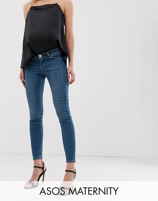 ASOS DESIGN Maternity lisbon mid rise skinny jeans in bright blue wash with over the bump waistba... | ASOS AU