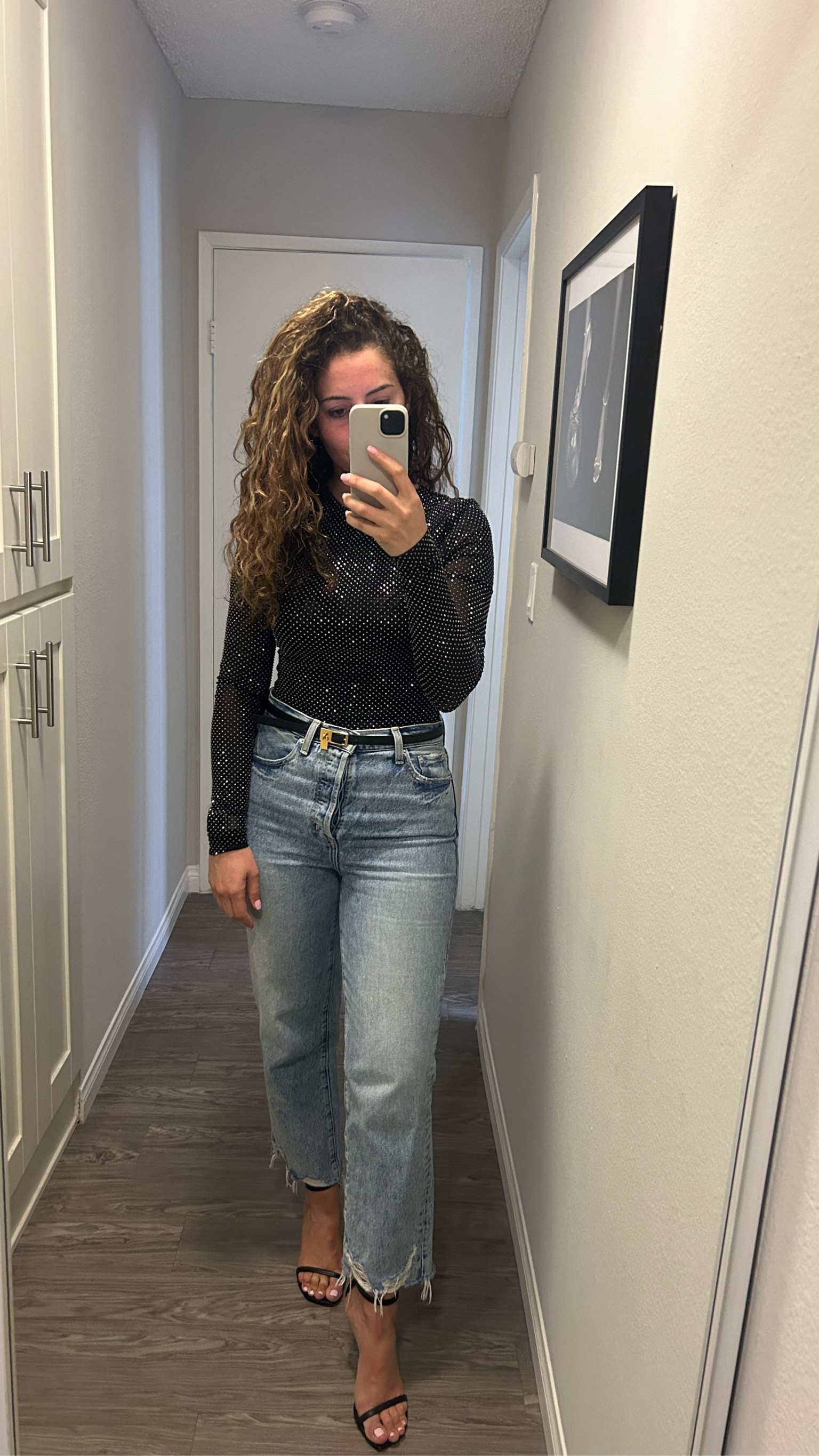 Meshki long sleeve sparkly bodysuit. I’m wearing a size small. 

Pistola Cassie crop jeans - size 26. 
Hermes reversible belt 
Stuart Weitzman Nudistcurve heels - black leather 

#LTKstyletip #LTKparties #LTKsalealert