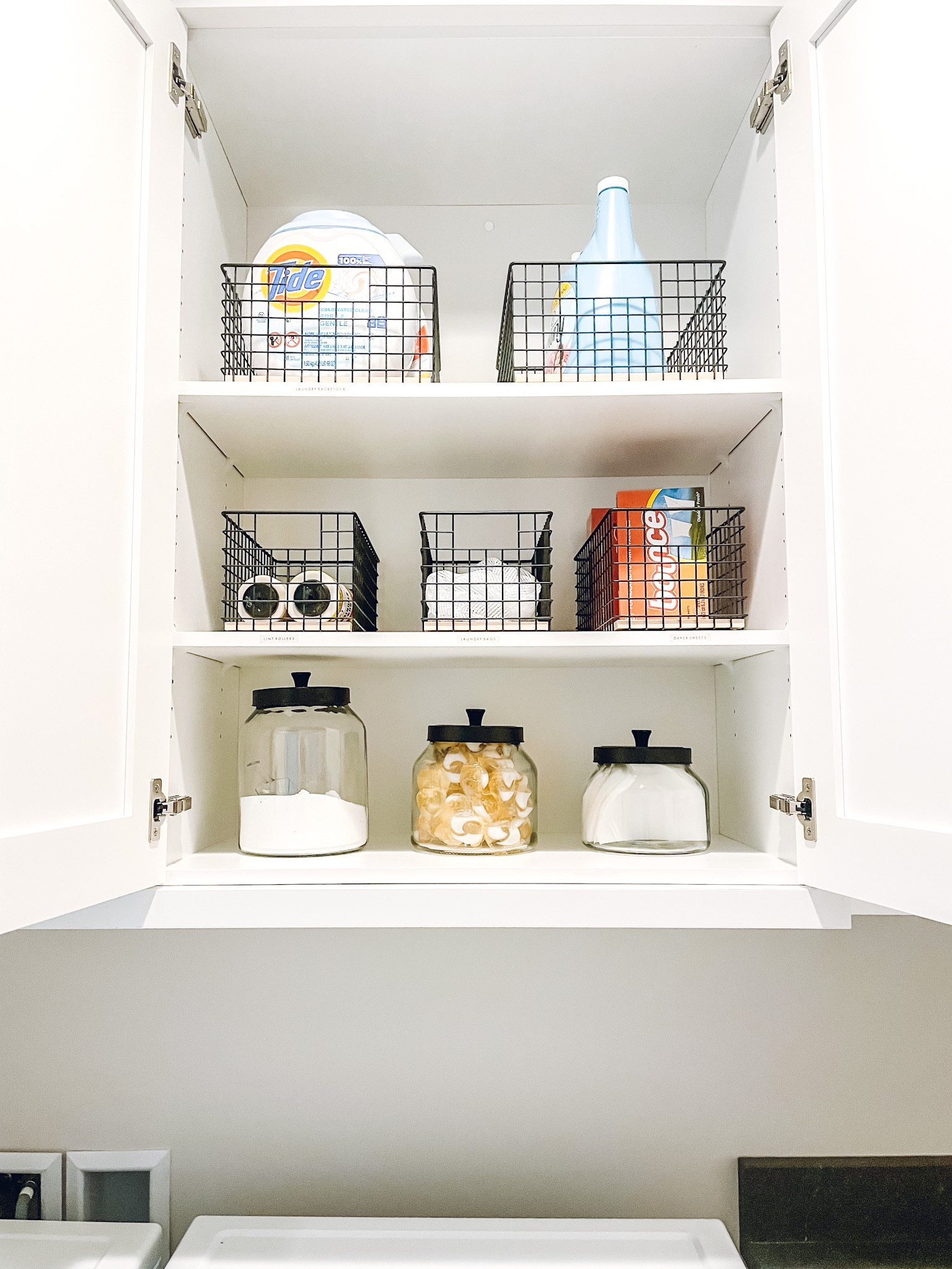 Laundry room organization. The Container Store glass canister and Stacking Wire Basket✨

#LTKfamily #LTKhome
