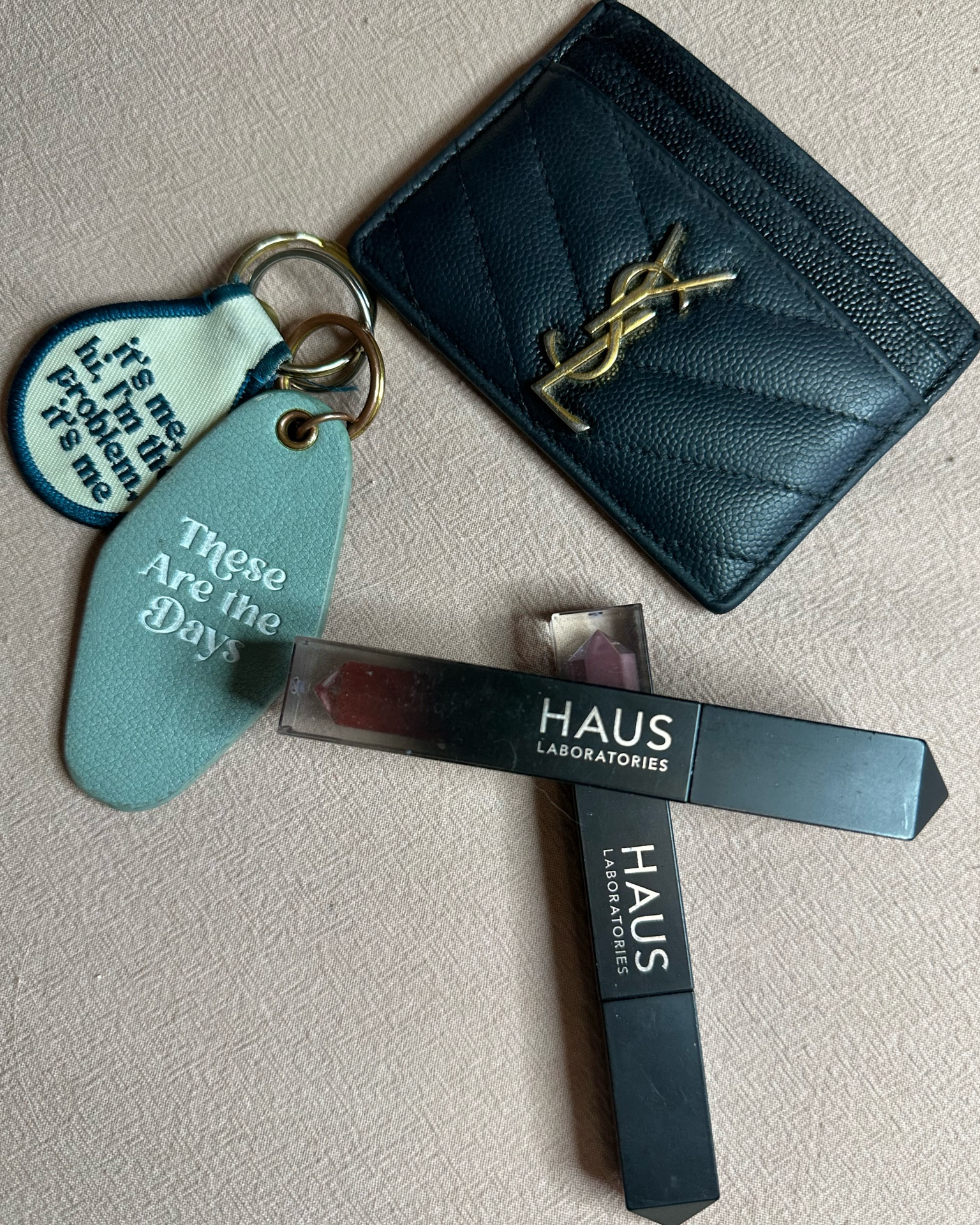 What’s in my daily bag? Only the essentials! 

I’m not a fan of clutter and carry the least amount of items possible, my wallet, keys, and my favorite Haus Labs Lip gloss