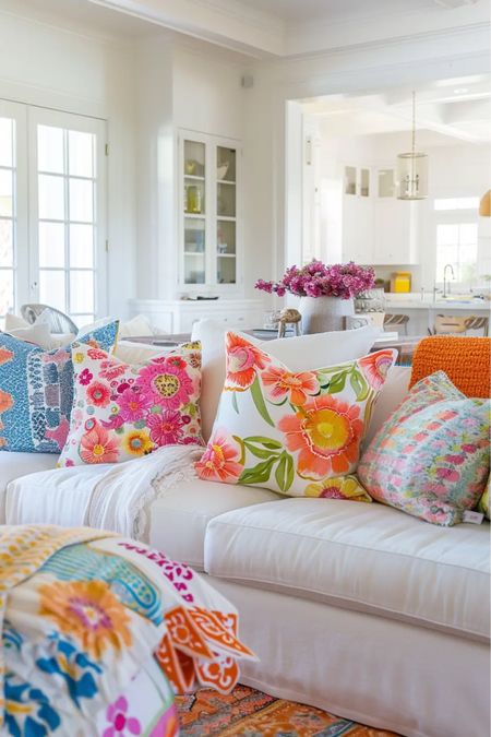 Dive into the playful side of summer decor by incorporating fun patterns and textures. Think breezy fabrics in whimsical prints, cheerful pops of citrus-inspired motifs, and the comforting embrace of soft, cotton blankets.

Let your imagination run wild as you layer textures and mix patterns to create a visual feast for the senses.

Summer home decor | summer decorating | summer living room | bright pillows | summer throw pillows | colorful decor | pattern pillows | flower pillows covers 

#LTKFindsUnder100 #LTKSeasonal #LTKHome
