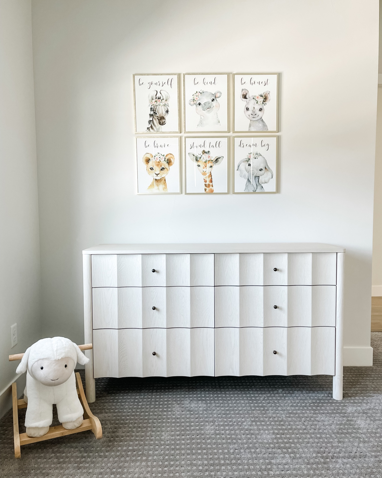 Nursery decor! Dresser and changing table. Lamb rocker and artwork. 

#LTKfamily #LTKbaby #LTKFind