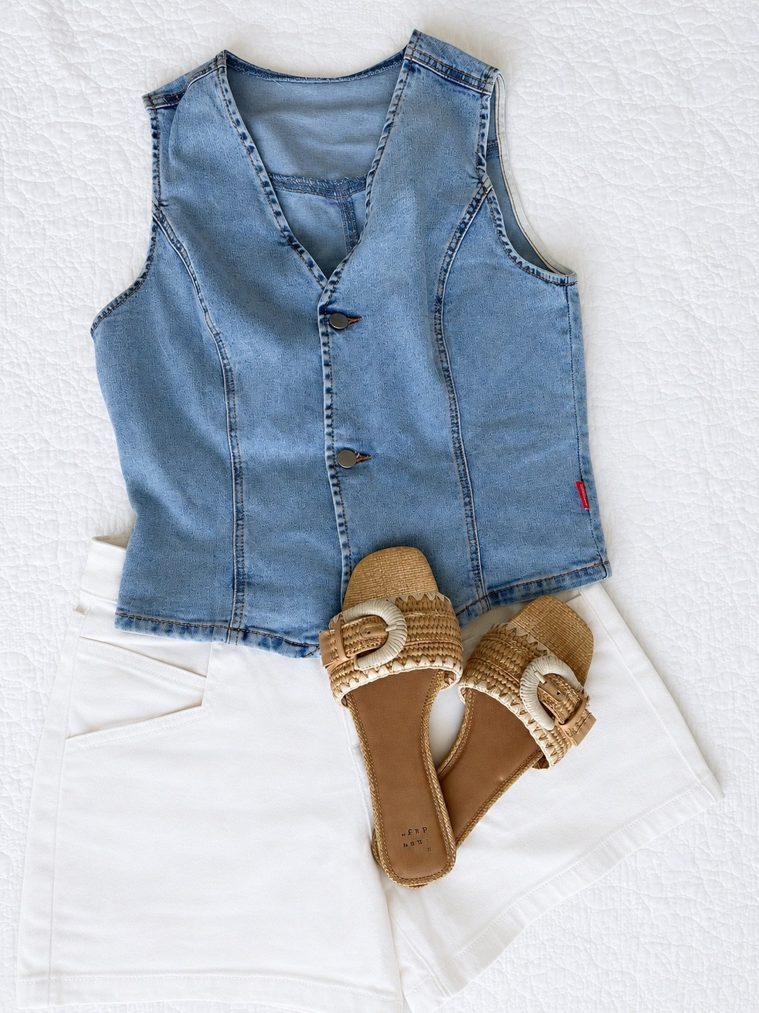 A denim vest and white shorts is one of those combinations that always feels polished for summer. The structured fit of the vest paired with woven buckle slides gives this look a relaxed, elevated feel that’s perfect for everyday wear, vacation, or weekend plans.

Sizing:
• Denim Vest: Wearing size Small
• White Shorts: Wearing size Small
• Sandals: Wearing size 7.5

denim vest outfit, white shorts outfit, summer outfit idea, casual chic style, woven sandals, vacation outfit, resort wear, neutral summer style, elevated casual outfit, everyday fashion, denim top, summer fashion finds, weekend outfit inspiration, classic summer look, warm weather style, capsule wardrobe, AudrieDollins

#LTKOver40 #LTKSeasonal #LTKootd