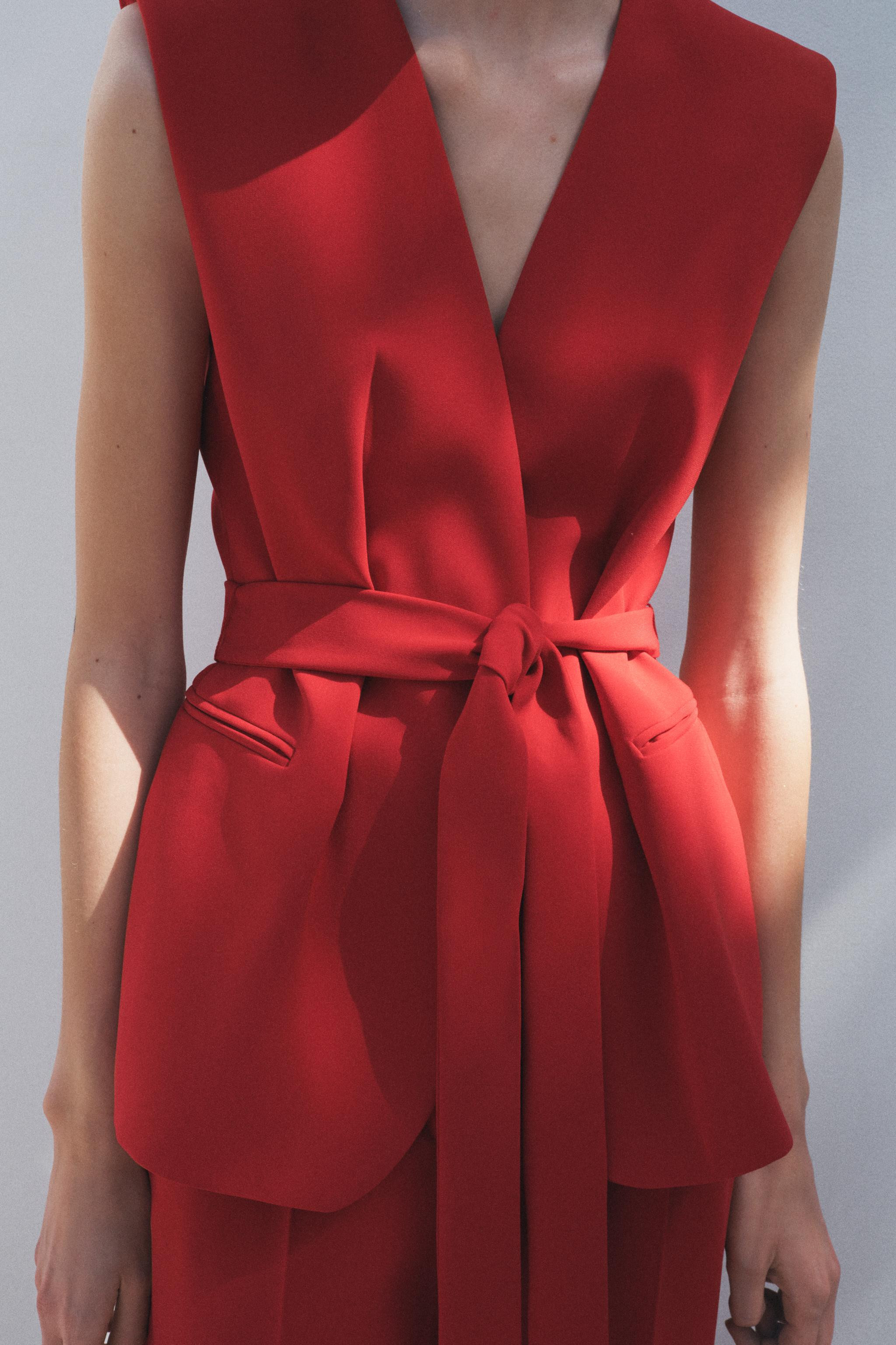 ZARA WOMAN COLLECTIONV-neck vest with shoulder pads. Front welt pockets. Self-tie belt. Matching ... | Zara US