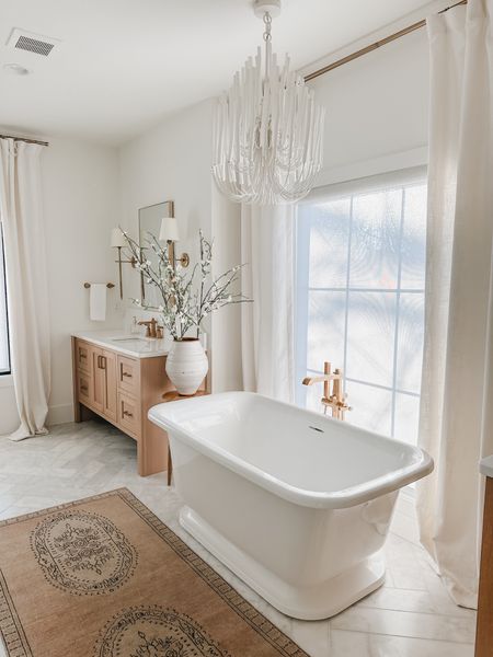 Light and bright spring bathroom! When creating this space, natural lighting was at the top of my list - my tub is showcased beautifully in front of this large mirror as a main focal point

Home finds, bathroom views, spring bathroom, light and bright, home detail, neutral home, aesthetic finds, faux linen curtain, faux florals, vase finds, rug runner, gold detail, lighting detail, Pottery Barn style, Target, Wayfair, Joss and Main, bathroom refresh, creamy whites, neutral wood tones, shop the look!

#LTKSeasonal #LTKstyletip #LTKhome