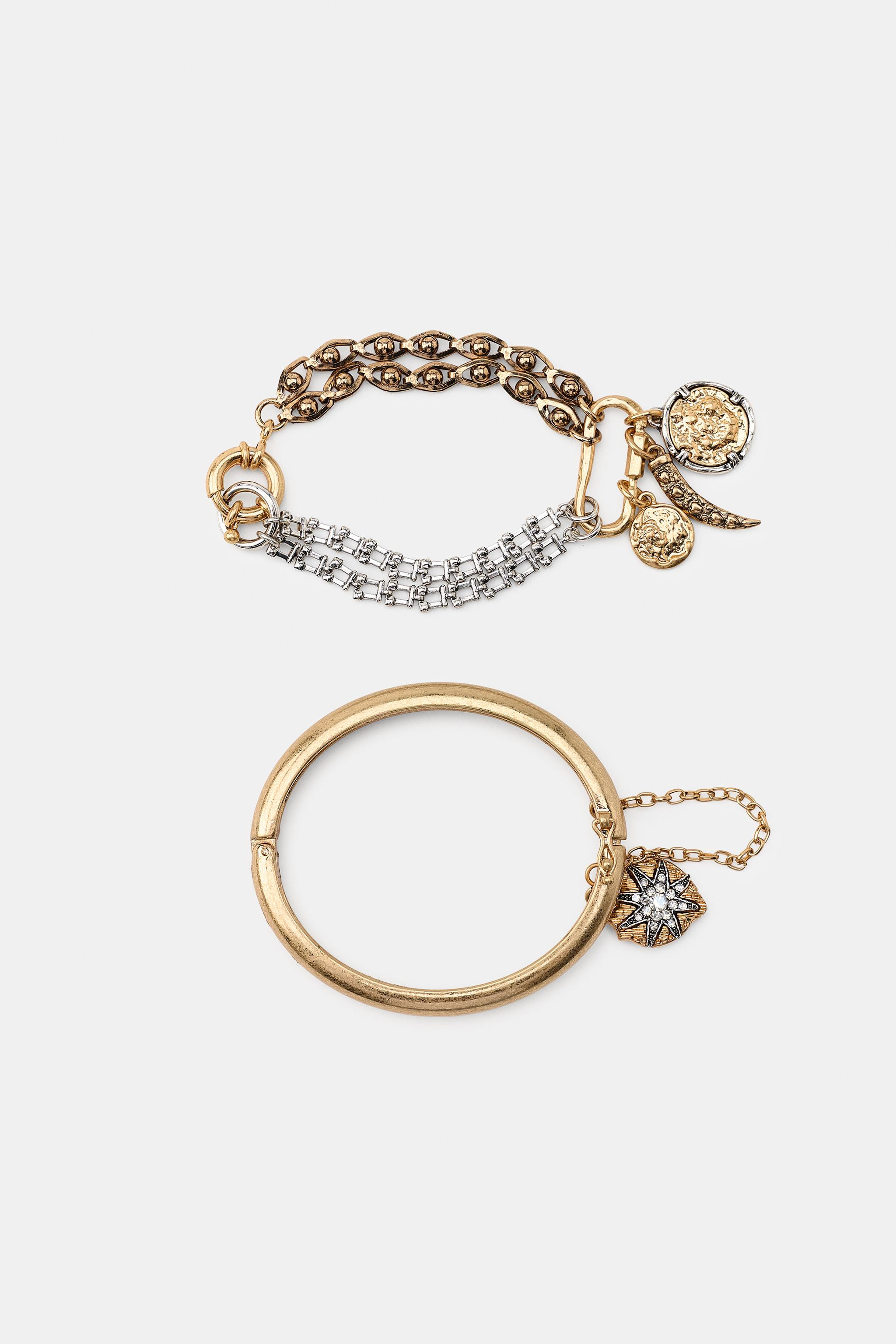 Two-bracelet pack: - Rigid hinged metallic bracelet. Clip closure. - Multi-piece metallic chain-s... | Zara US