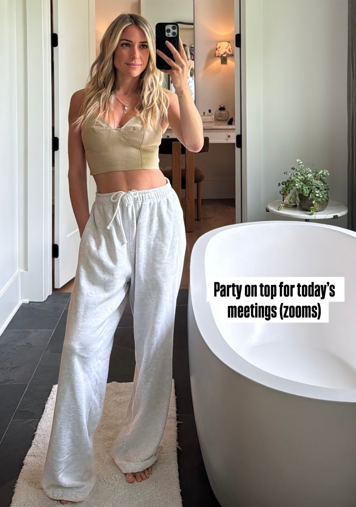 Kristin Cavalleri's French gray Terri oversized straight leg jogger cropped linen blend bustier crop top and pearl lariat gold necklace