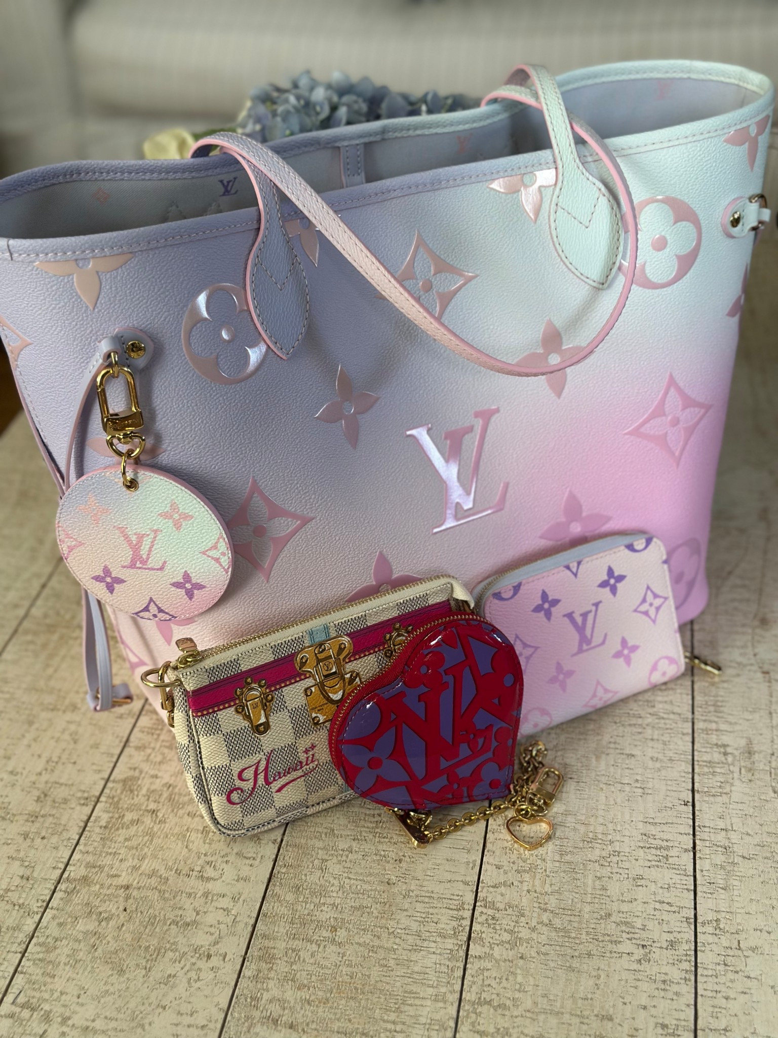 Happy Tote Tuesday! Feels like spring so bring out my LV Neverfull MM in Sunrise Pastel with the matching bag charm, zippy coin. I also added my trunks Hawaiian mini Pochette and  the same heart coin as yesterday. 

#LTKItBag #LTKSeasonal #LTKGiftGuide