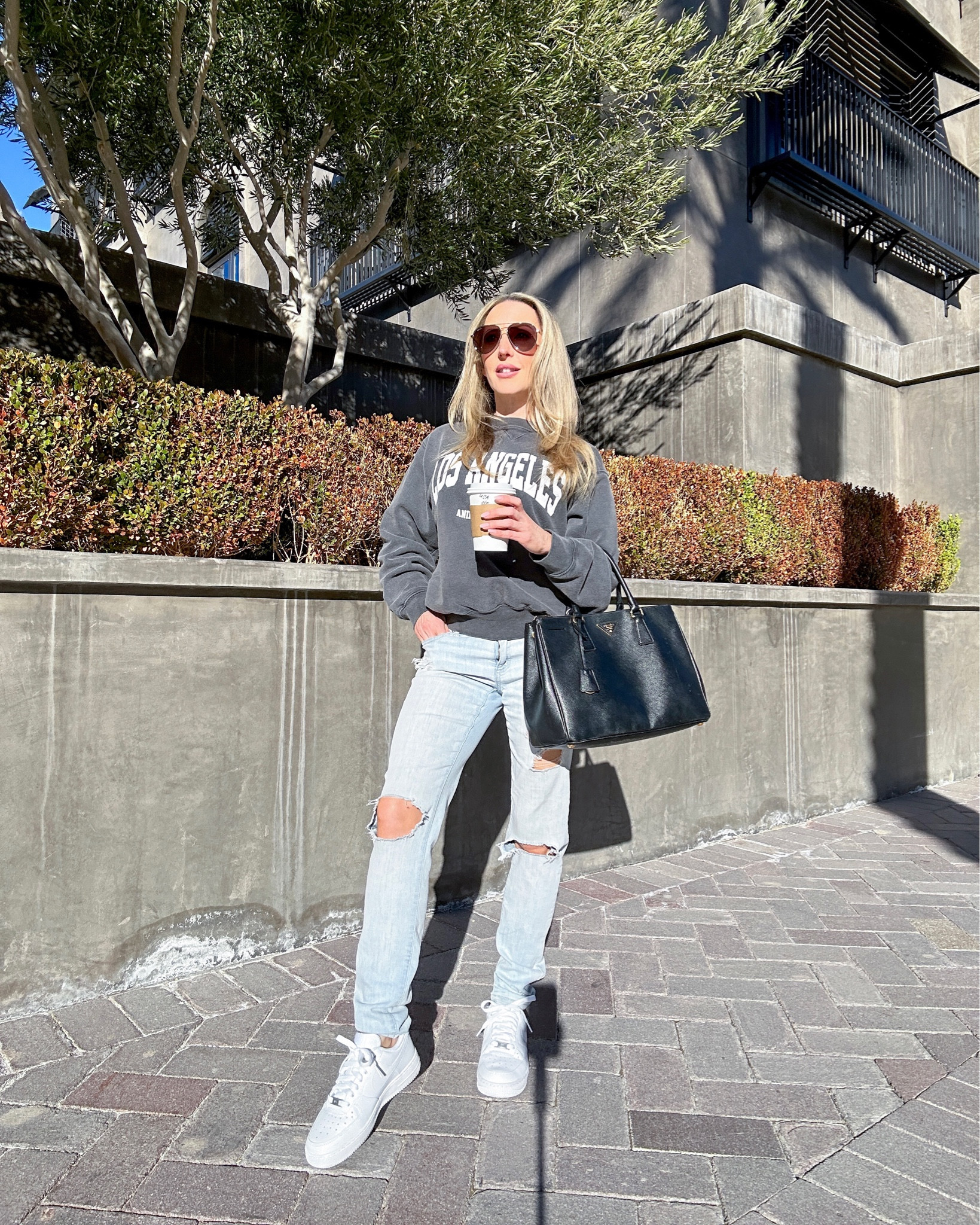 Anine Bing Los Angeles sweatshirt. Grey sweater, black Prada top handle tote bag, womens white Nike Air Force 1.

#aninebing #casualoutfit #streetstyle



#LTKSeasonal #LTKFind #LTKshoecrush