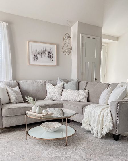 Neutral and cozy living room ✨



Grey couch, grey sectional, corner sofa, white pillows, winter artwork, white blanket, textured blanket, round coffee table, glass coffee table, blue pillow, geometric light, winter decor 

#LTKhome #LTKFind #LTKSeasonal