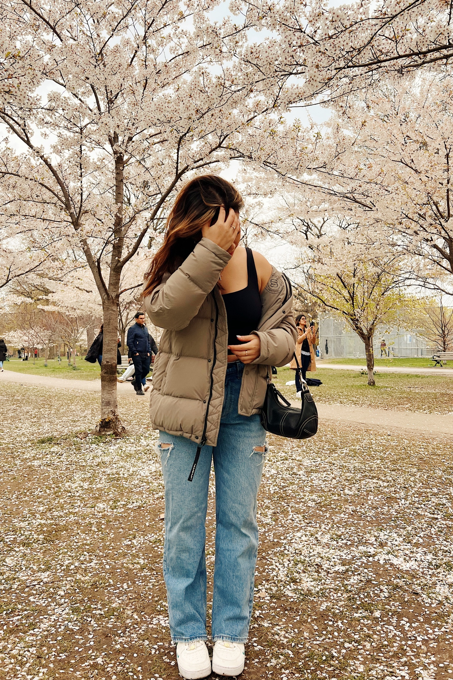 Spring outfit for overcast day at Trinity Bellwoods in toronto. Beige Superpuff aritzia jacket, light wash Abercrombie jeans with rips, and green Nike air forces. #LTKFestival

#LTKfindsunder100 #LTKstyletip #LTKSeasonal