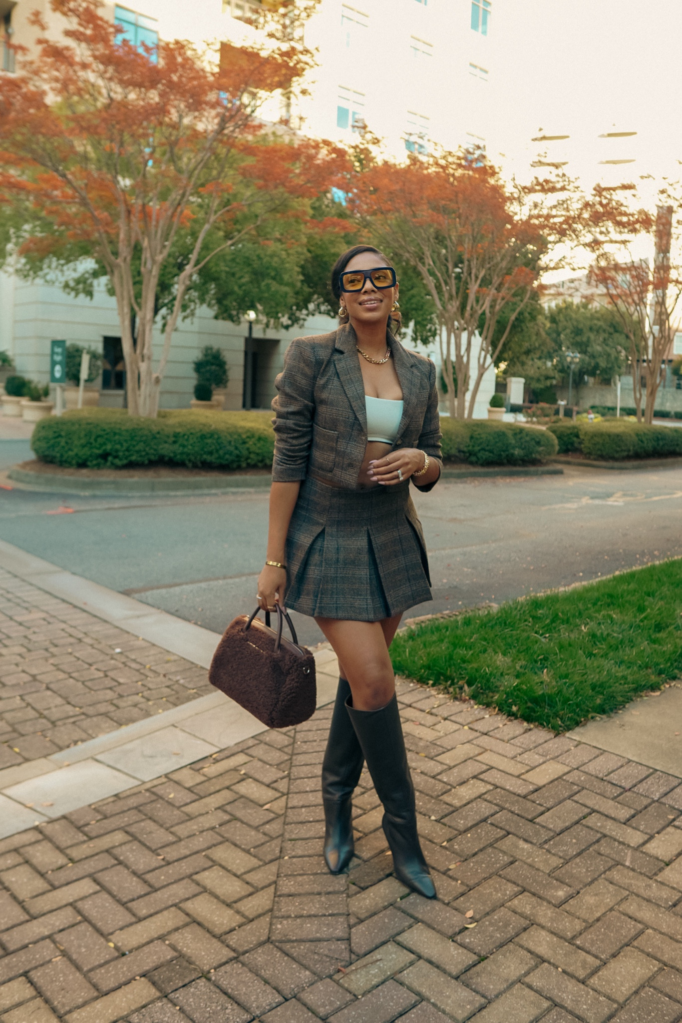 This skirt suit is perfect for this fall weather that is giving summer 🤣 

Wearing a Medium in both & size is 9 in boots. 
Bag: Brandon Blackwood
Sunglasses: Lorvae 
