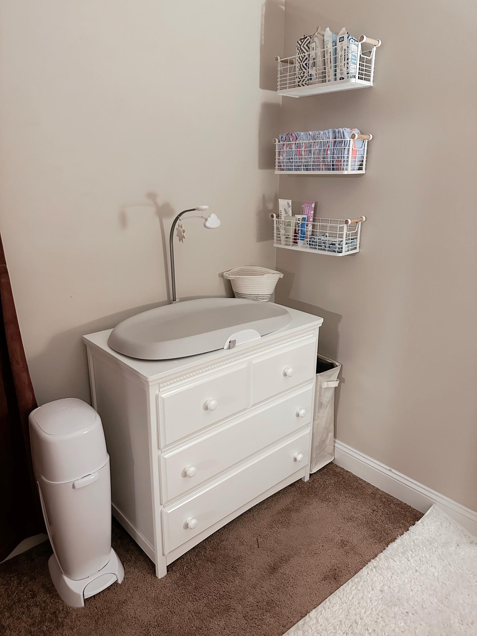 LOVE our changing station. So many people said we would never use it and it's how we change every diaper for her. Just so much easier having it all in one spot! This changing pad is so nice! Soft for their delicate bodies and comes with a little toy that hangs above it for when they need some distractions! Also- wipes clean and doesn't require changing the changing pad cover!

Diaper genie- this fills quick but still love it and worth it for us!



#LTKbaby #LTKkids #LTKbump