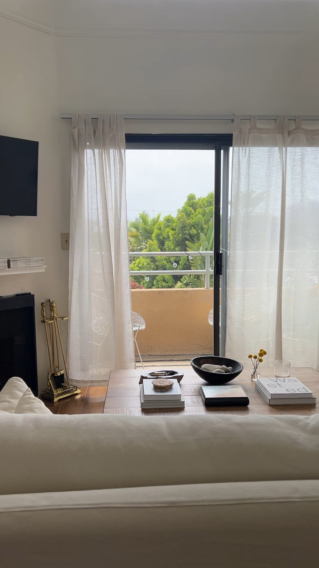 Moved the couch and love how I get to look out at the trees now :) linking curtains. They’re the same ones I used to have in my bedroom, I just moved them out here when I put blackout shades in my room.