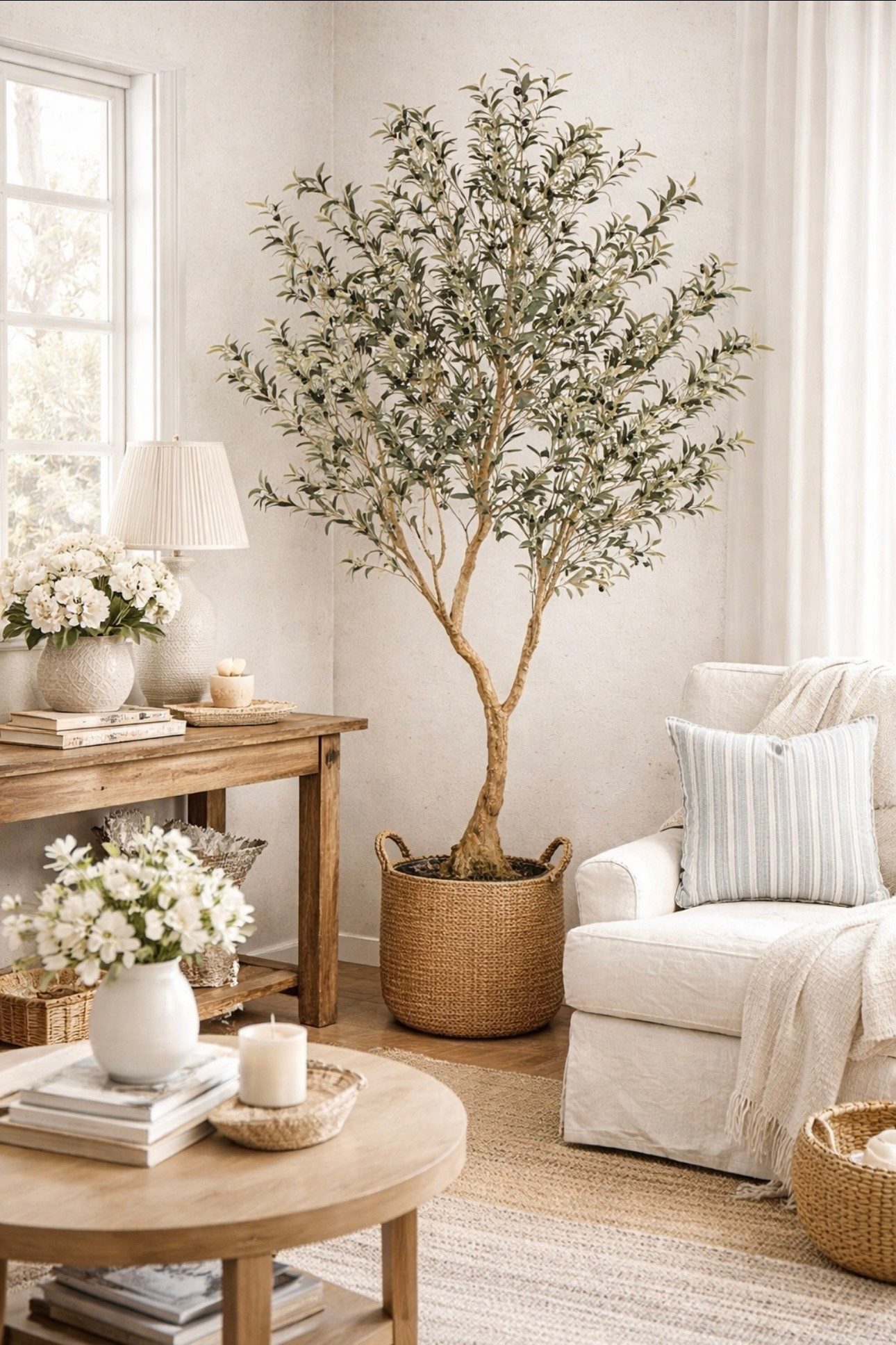 I love faux trees and flowers! Plus, it’s so easy to bring greenery and florals to your space. This is a 6 foot four olive tree, perfect for farmhouse, coastal and light neutral interiors. Add realistic and timeless charm to your living space, bedroom, entryway, and more…plus there’s no maintenance required!￼Olive tree, home plants, faux olive tree, interior designn