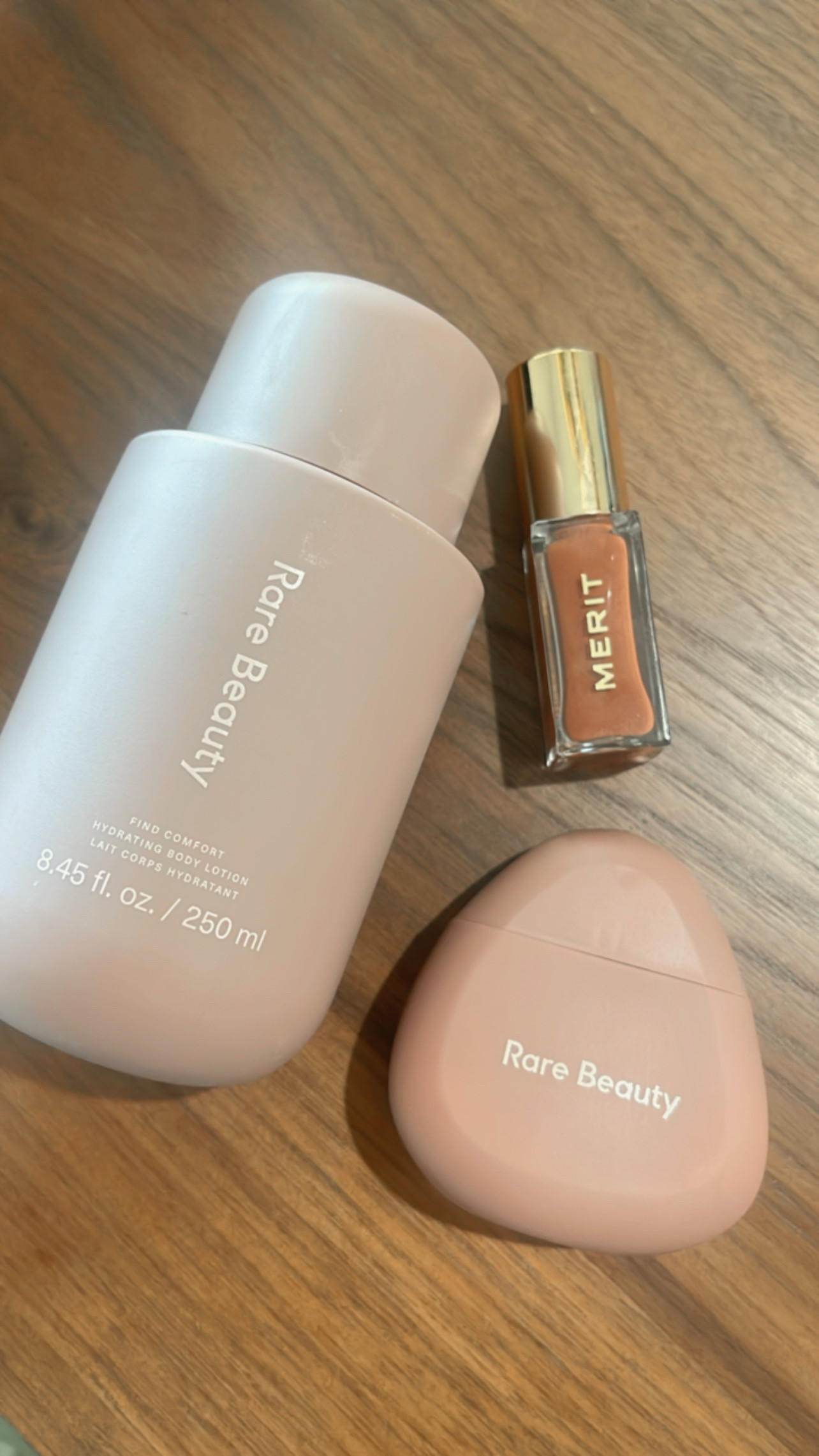 Self-care, but make it pretty 💖

These are the products I’ve been reaching for lately:
☁️ Rare Beauty hydrating body lotion
💧 Rare Beauty hand cream
💋 Merit Beauty tinted lip oil in a perfect warm nude

They feel just as good as they look — lightweight, hydrating, and perfect for summer days when less is more.
Linked them all for you on my LTK! 🛍️✨

#rarebeauty #meritbeauty #beautyroutine #cozymomlife #summerbeautyfavorites #ltkbeauty #ltkmom #aestheticflatlay 

 #LTKFindsUnder50 #LTKStyleTip #LTKBeauty