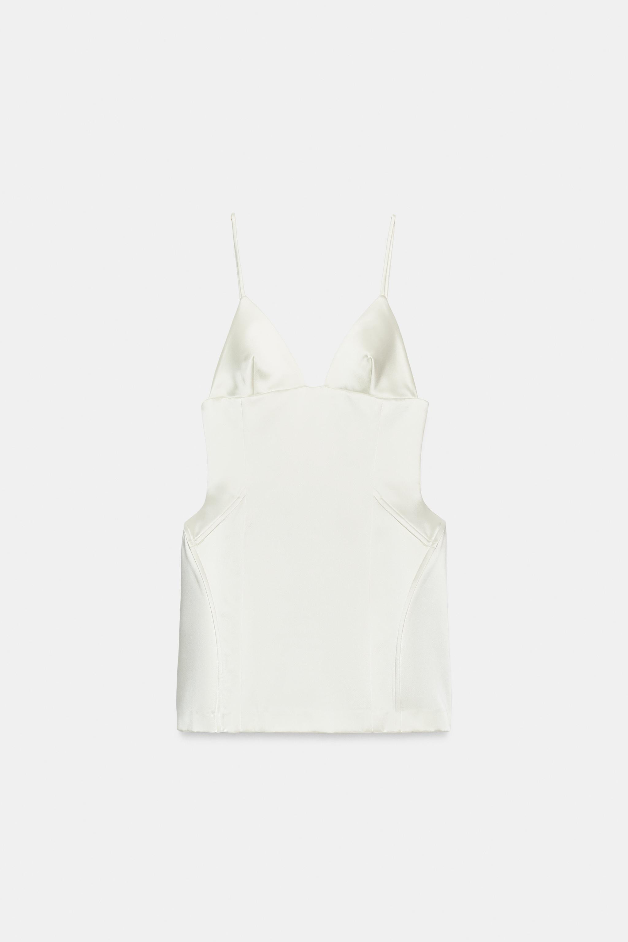 V-neck mini dress with adjustable thin straps. Featuring metal boning and a matching tone-on-tone... | Zara UK