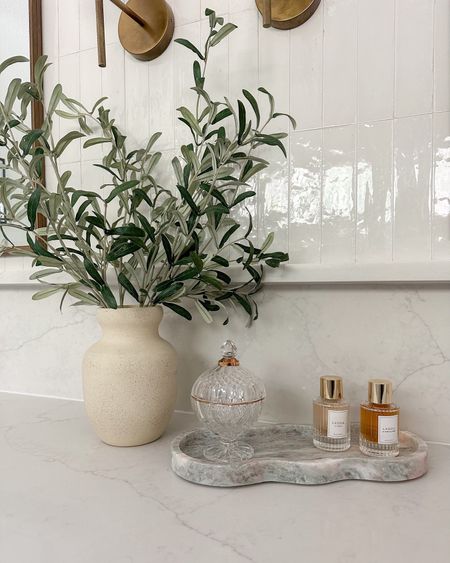 This olive arrangement and on trend wavy marble tray from Target are perfect for easy bathroom countertop decor! 

#LTKfindsunder50 #LTKstyletip #LTKhome