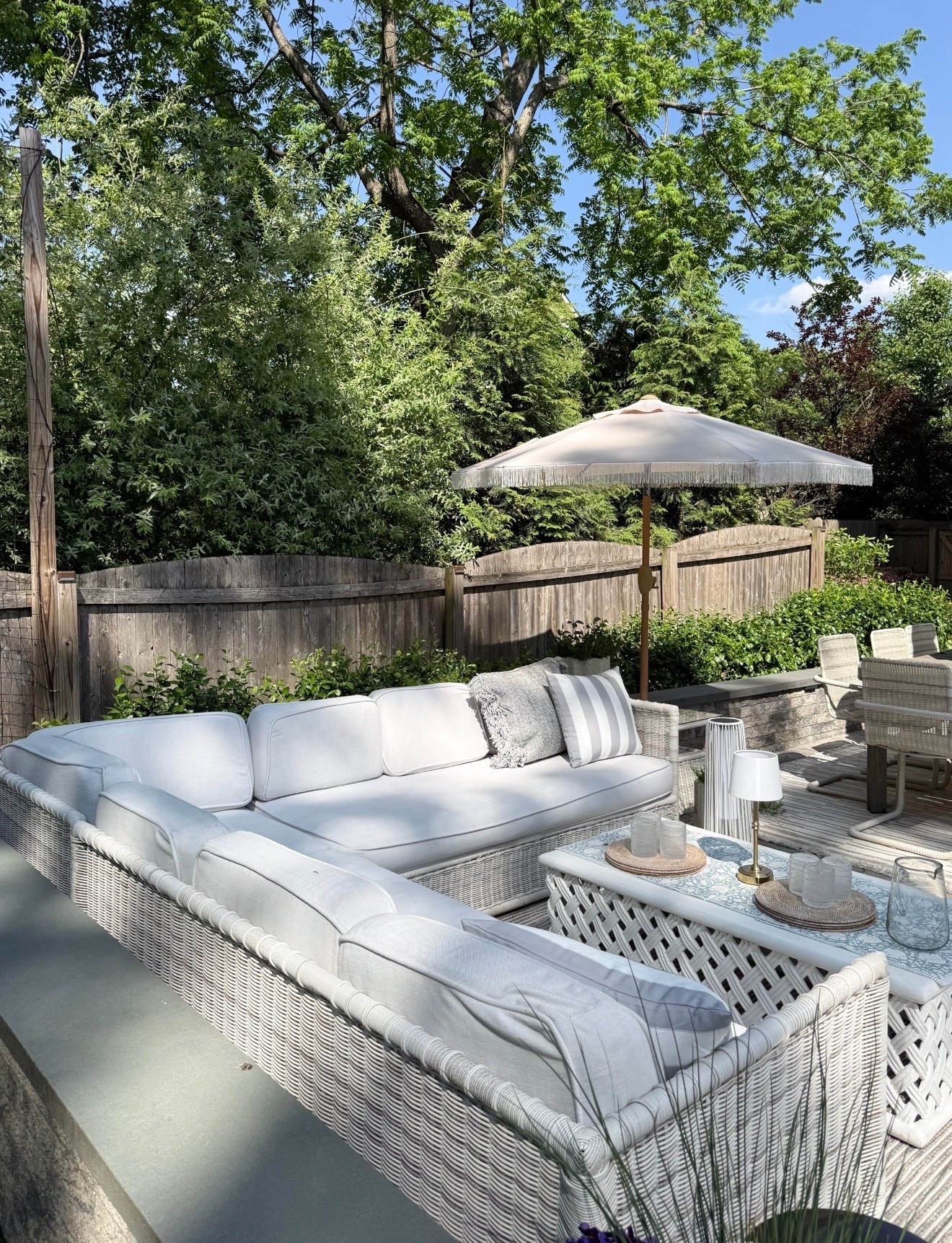 This outdoor setup feels like the definition of a summer backyard refresh. The neutral woven furniture, striped umbrella, and layered textures make the whole patio feel cozy, elevated, and perfect for slow summer evenings outside. Outdoor patio furniture, Backyard oasis inspiration, Neutral outdoor decor, McGee and Co inspired patio, Woven outdoor furniture, Patio styling ideas, Outdoor entertaining space, Summer patio refresh, Luxury backyard decor, Coastal outdoor living, Outdoor sectional sofa, Girl on the Hudson

#LTKSeasonal #LTKHome