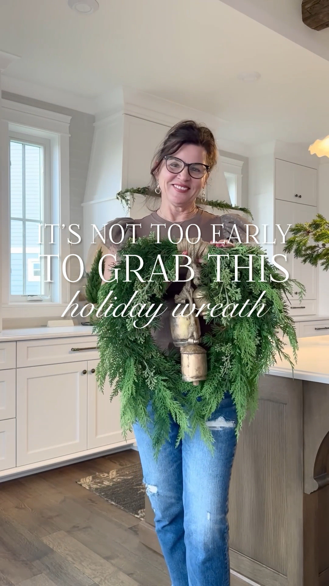 It’s not too early to grab this holiday wreath! It’s a favorite of mine because of its unique shape, it’s realistic, the mixed greenery and the price! I use the 22” on my range hood. 

ADDING BELLS & BOWS —
▫️Loop the small and medium bells over the large one.
▫️Flip bells over and tuck the large loop under and around the top of the wreath.
▫️Tie the large bell loop and the small bell loop together with floral wire. This will pull the smallest bell up slightly and keep your bells contained. 
▫️Flip over.
▫️Cut 1-2” velvet ribbon to your desired length. Pull behind loop and tie a knot, twisting ribbon to keep velvet side forward.

TIE YOUR BOW —
Make your first loop with the lower ribbon. The upper ribbon goes over the top of the first loop. Tuck it back through, twisting the ribbon to keep the velvet forward.  

FOR A TIDY BOW…
Right over Left - knot
Left over Right - bow

▫️Hang with a large Command hook.

#ltkholiday

#LTKvlog #LTKHome #LTKSeasonal