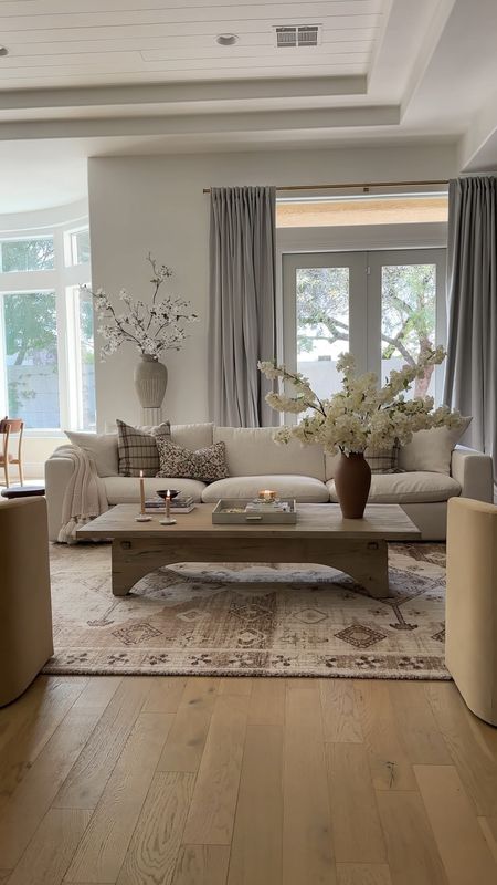 Living room and dining room 

Coffee table, florals, vases, chairs, couch 

#LTKVideo #LTKfamily #LTKstyletip