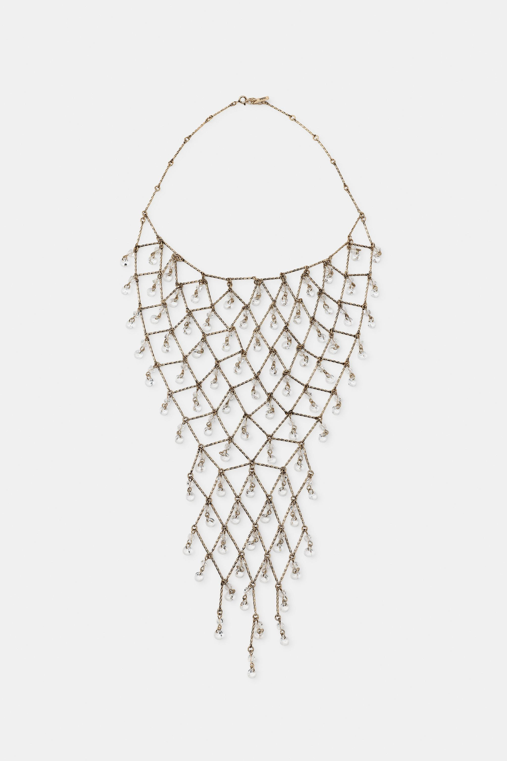 Model height: 183 cmMetal bib-style necklace with multiple contrast jewel pendants. Lobster clasp... | Zara UK