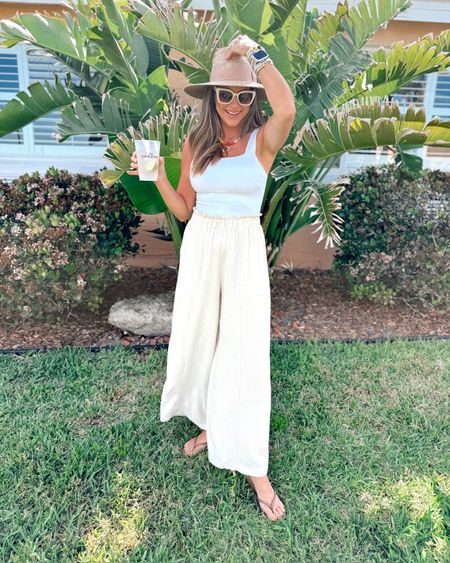 In a small square neck tank bodysuit, medium linen wide leg pants, necklaces, hat, sandals and accessories for spring - all fits TTS.

#LTKstyletip #LTKfindsunder50 #LTKSeasonal