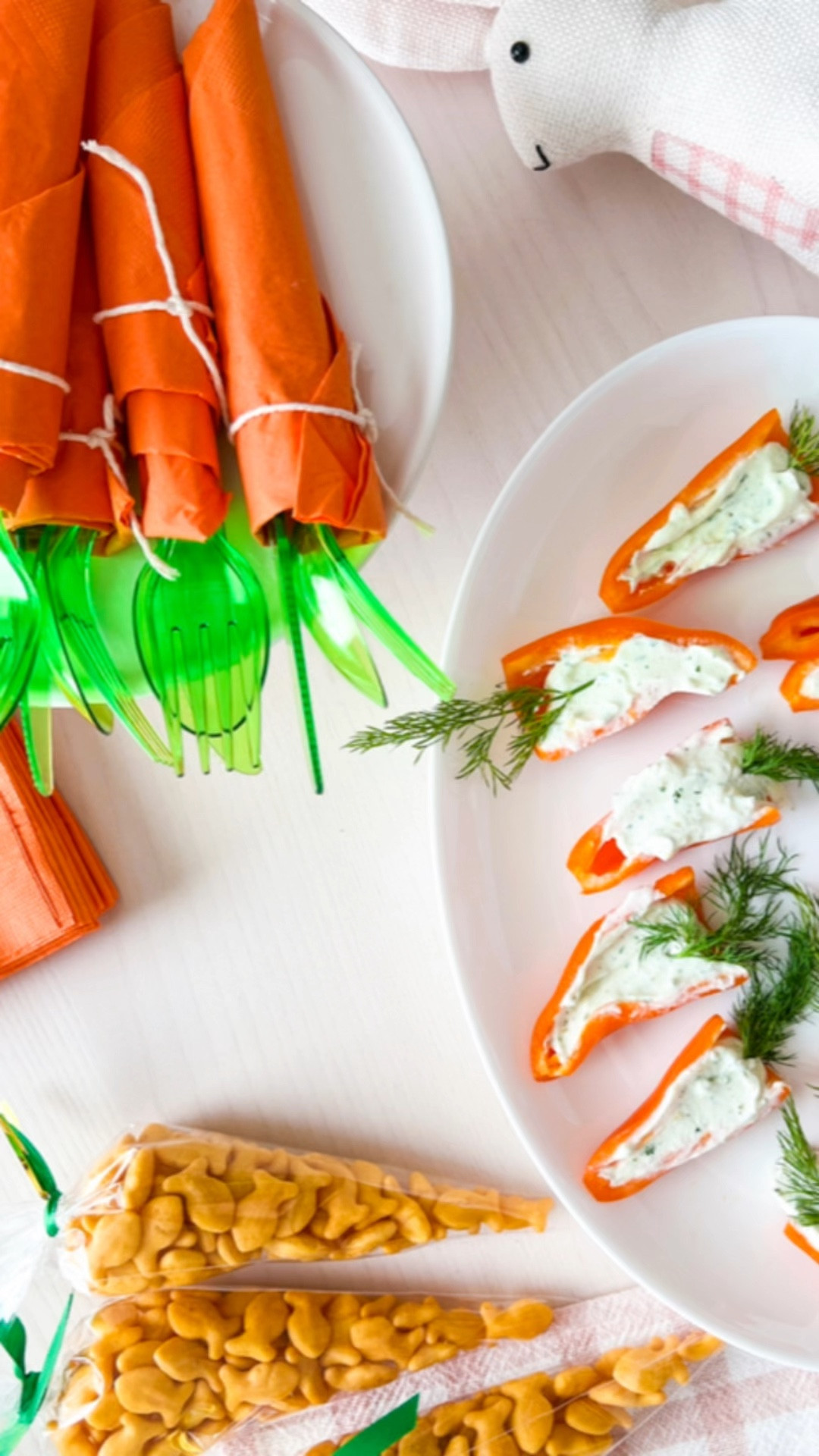 3 Carrot Themed Easter Ideas:
Here are some last minute easy Easter Ideas:   

1) Orange napkins wrapped around green cutlery to create the look of carrots when entertaining. You can secure with cooking twine and display in an empty terracotta pot for a festive touch, or on my favorite bunny cake stand!

2) Carrot shaped treat bags: fill cone shaped bags with cheese balls or goldfish crackers; secure with a twist tie and tie a green ribbon around the top. The treat looks orange like a carrot and makes a fun snack or party favor!

3) Mini pepper 'carrots': I buy bags of mini peppers and use the orange ones for this appetizer or snack. Slice peppers in half lengthwise and fill each pepper half with cream cheese or  ranch dip. (I use the ranch packets and substitute plain yogurt for the sour cream.) Finally, place a sprig of dill at the wider end to make the mini pepper look like a carrot. These are a cute and tasty appetizer or snack!

Save this post for later and follow along for more Seasonal and Holiday Ideas!

I made all of these Easter ideas LIVE on Pinterest a few weeks ago; the episode is saved on my pinterest profile if you want to watch the replay!



Easter , easter ideas , appetizers , easy snack idea , easter appetizer , bunny cake stand , amazon finds , amazon home #ltkhome



#LTKhome #LTKunder50 #LTKSeasonal