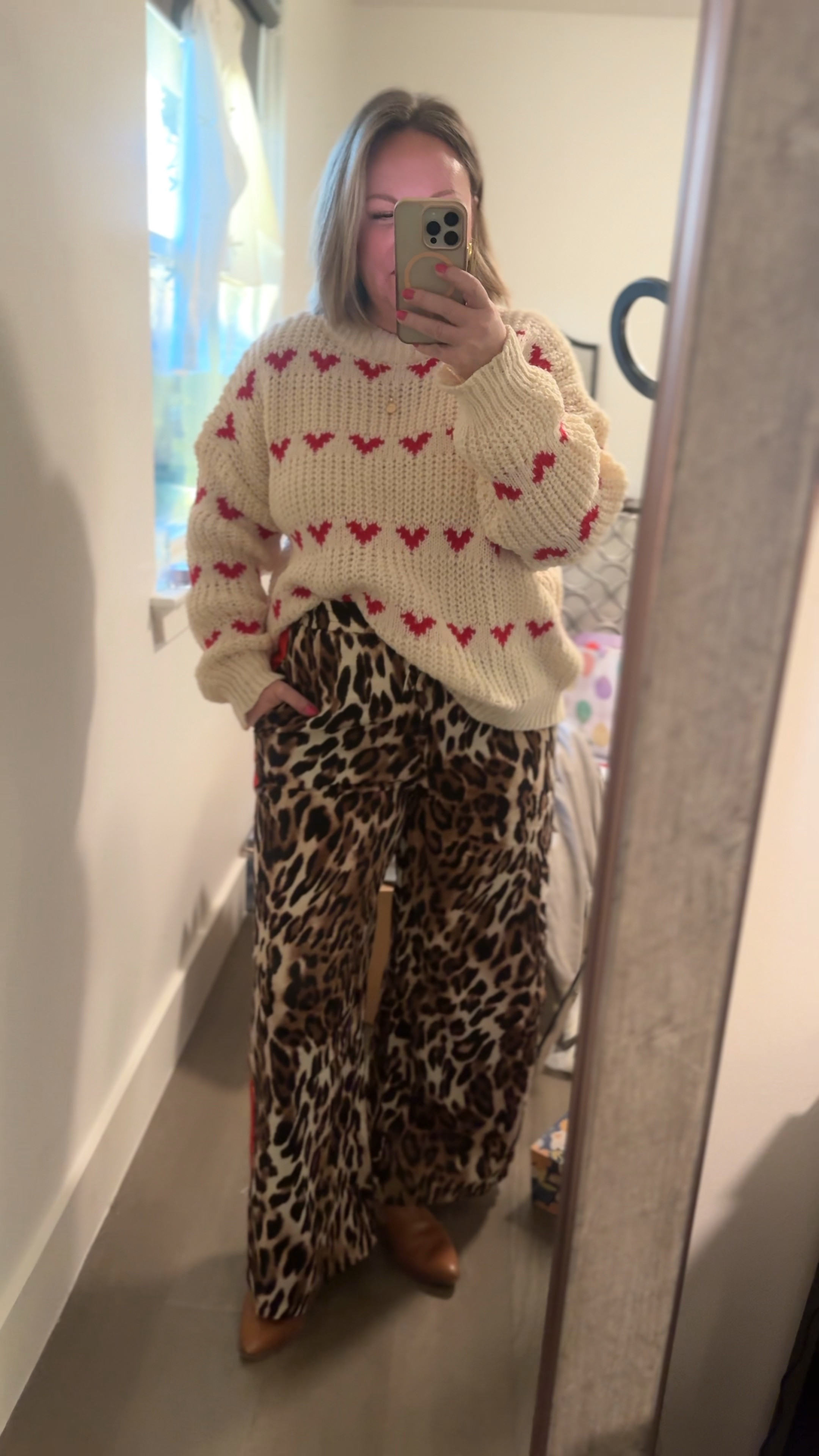 Super trendy pieces under $15!!! Love the pattern mixing with the heart sweater and leopard track style pants. Large sweater, XL pants

#LTKStyleTip #LTKFindsUnder50 #LTKSeasonal