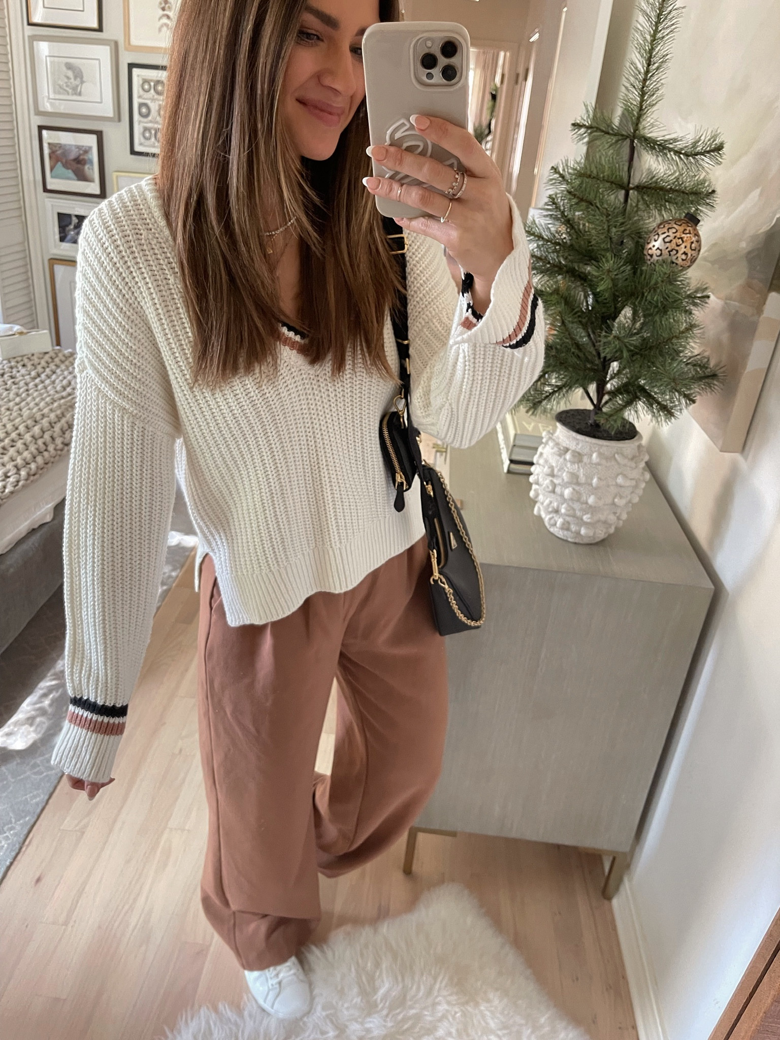 I love the details on this knit sweater😍comes in a few colors & is under $50. Wearing a S in sweater & my true size in trousers. Sneakers fit TTS // Abercrombie, winter outfit, winter style, winter trends, winter fashion, neutral outfit