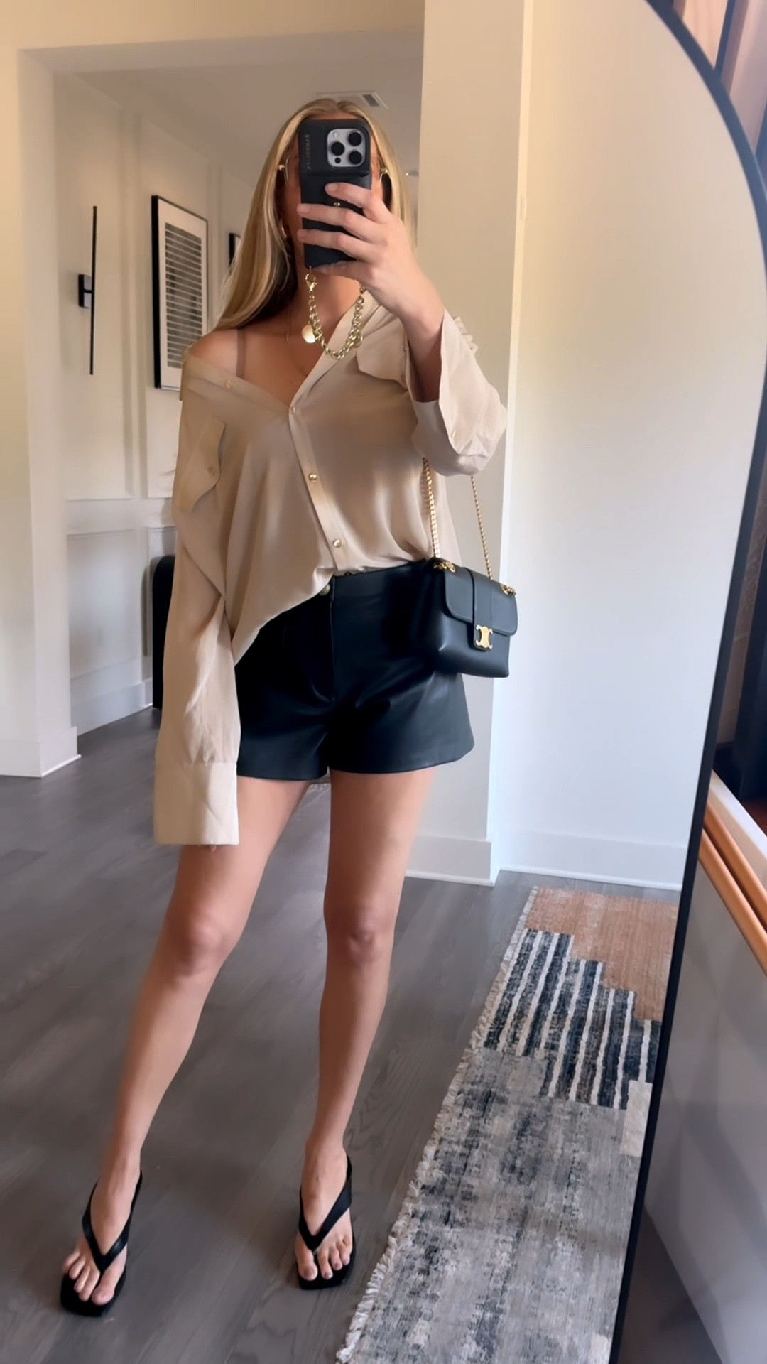 It’s getting hottt in Austin and I love this oversized silk shirt from @Alice + Olivia with my old fave @L'AGENCE shorts that are now 50% off paired with these look for less Amazon sandals and sunglasses and Celine bag