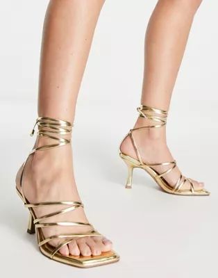 ASOS DESIGN Hiccup strappy tie leg mid heeled sandals in gold | ASOS (Global)