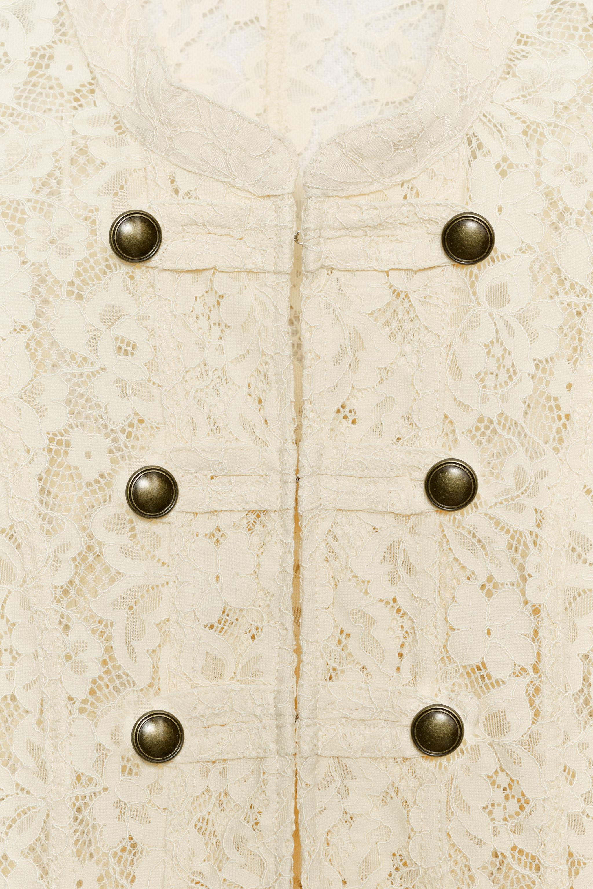 Jacket made with polyamide yarn. Stand collar and long sleeves. Front fastening with metal hooks. | Zara US