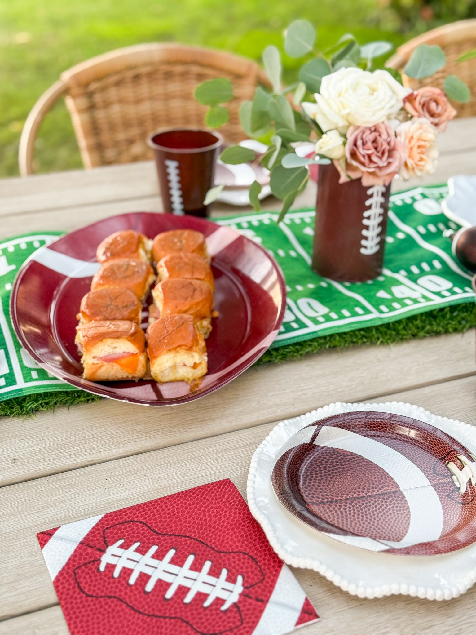 Super Bowl finds. Super Bowl party tablescape essentials. Football shaped platter for appetizers. Football table runner. Touchdown table runner. Football plates. Football napkins. Super Bowl centerpiece. Metal football vase with koko loko roses. 🏈❤️ 

#LTKHome #LTKSeasonal #LTKPetite