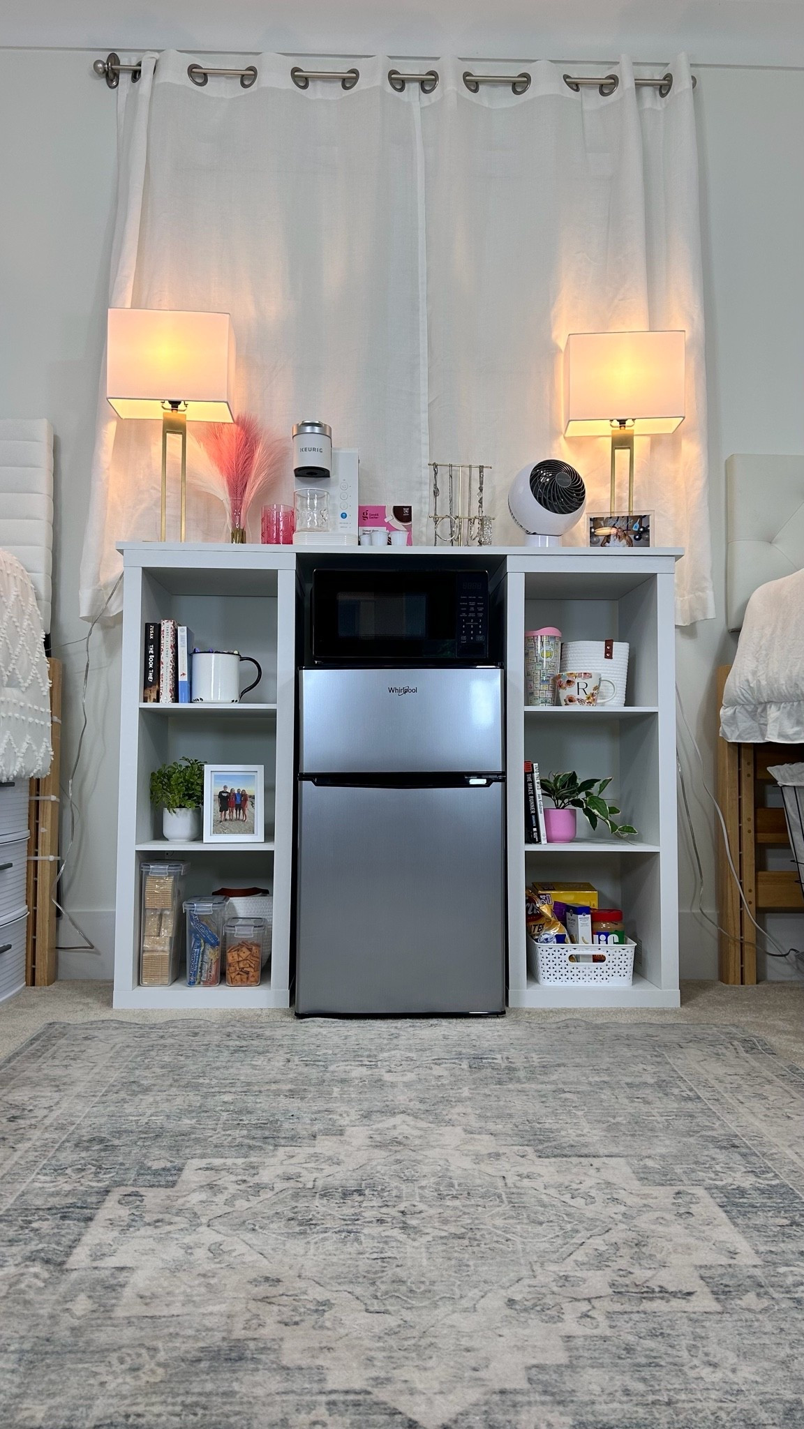 The “Fridge Bridge” was one of our most-shared dorm solutions last year after we created it in our dorm lab and shared the setup on Instagram, so we’re bringing it back again for 2026.

You may have seen much more expensive furniture pieces designed to do something similar, but we’re always looking for practical, functional, and budget-friendly dorm solutions. 

This setup not only adds extra storage for snacks and kitchen essentials but also doubles as a nightstand for both roommates.

To build “The Fridge Bridge,” all you need is:
✨ Two 13” 3-cube organizers (the 11” versions just aren’t sturdy enough)
✨ A closet shelf cut to size (we had ours cut at Lowe’s)

That’s it!