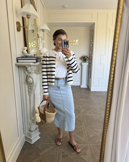 Loving this recent spring outfit. A denim skirt, sandals, white tee, straw bag, and striped cardigan are perfect for a casual chic outfit! My cardigan is from H&M, so I’m linking that and others. Linking similar skirts as well!

#LTKfindsunder100 #LTKstyletip #LTKSeasonal
