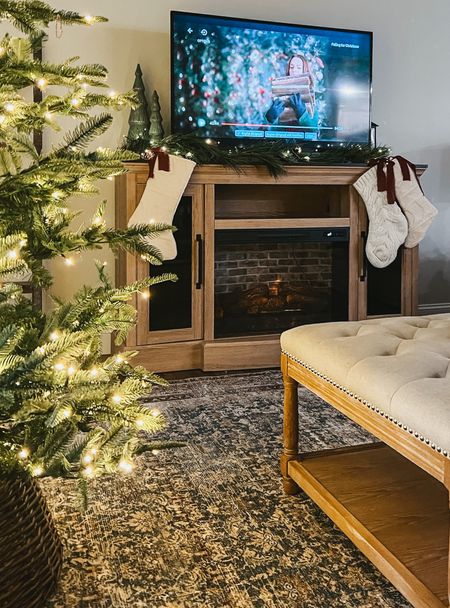 Christmas living room decor 
Tv stand fireplace 
Christmas tree 
Christmas garland 
Christmas decor finds 
Loloi area rug 
Amazon home decor 


#LTKHoliday #LTKsalealert #LTKstyletip